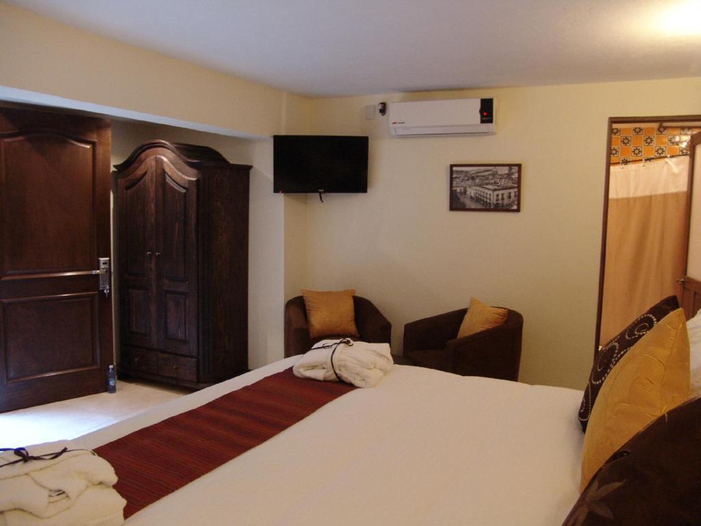 Casa Del Tio Hotel Boutique Σαν Μιγκέλ ντε Αγιέντε Δωμάτιο φωτογραφία A room at the hotel